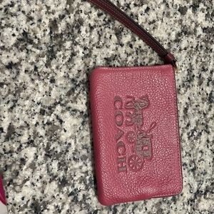 Pink coach wristlet.